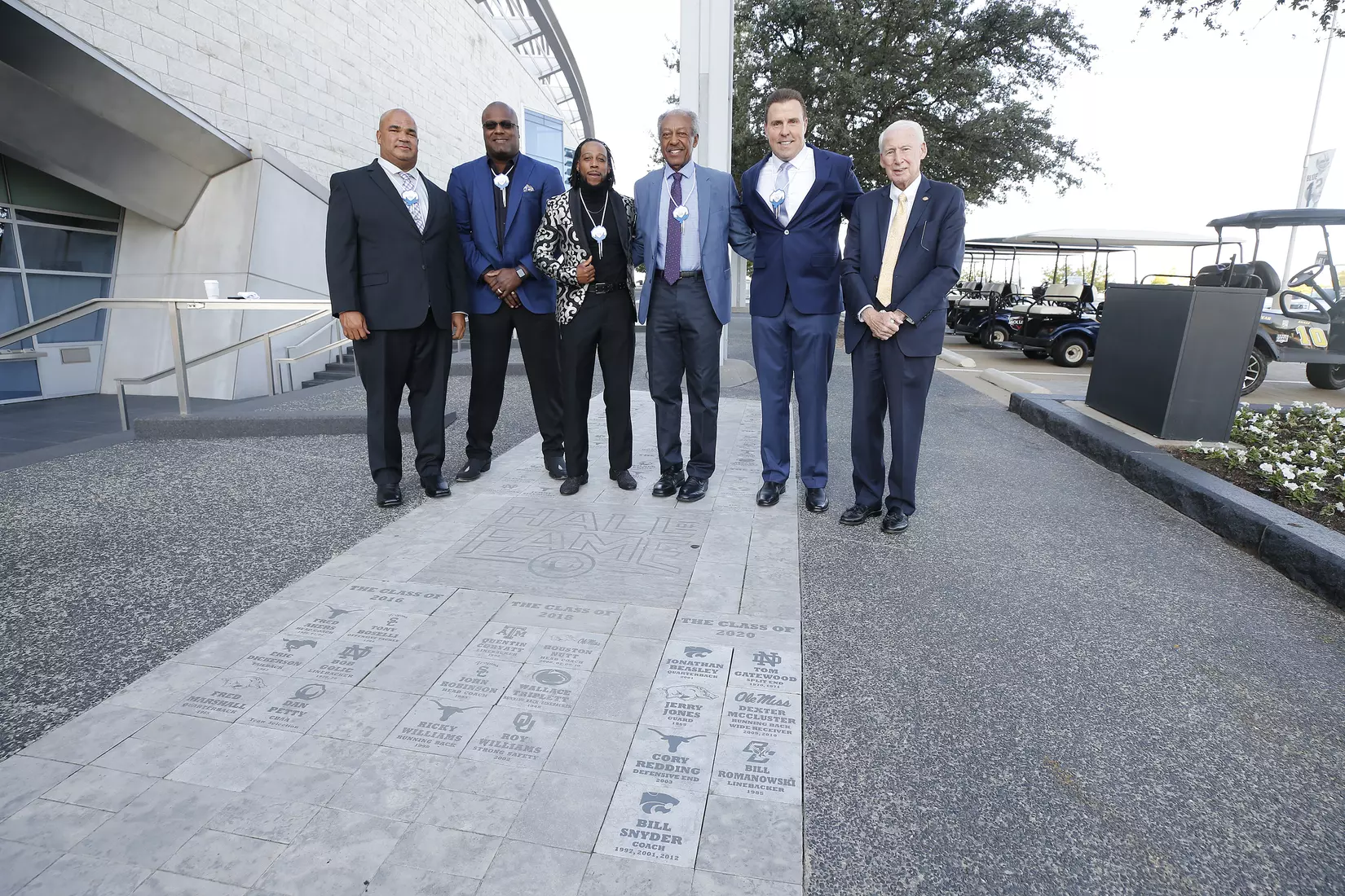 05 October 2021: Jonathan Beasley of Kansas State; Cory Redding of Notre Dame; Dexter McCluster of Mississippi; Tom Gatewood of Notre Dame; Bill Romanowski of Boston College; and Coach Bill Snyder of Kansas State pose with their bricks for the 2020 Cotton Bowl Hall of Fame class at the induction ceremony at AT&T Stadium in Arlington, Texas. Not pictured was Jerry Jones of Arkansas. Photo by James D. Smith/CBAA