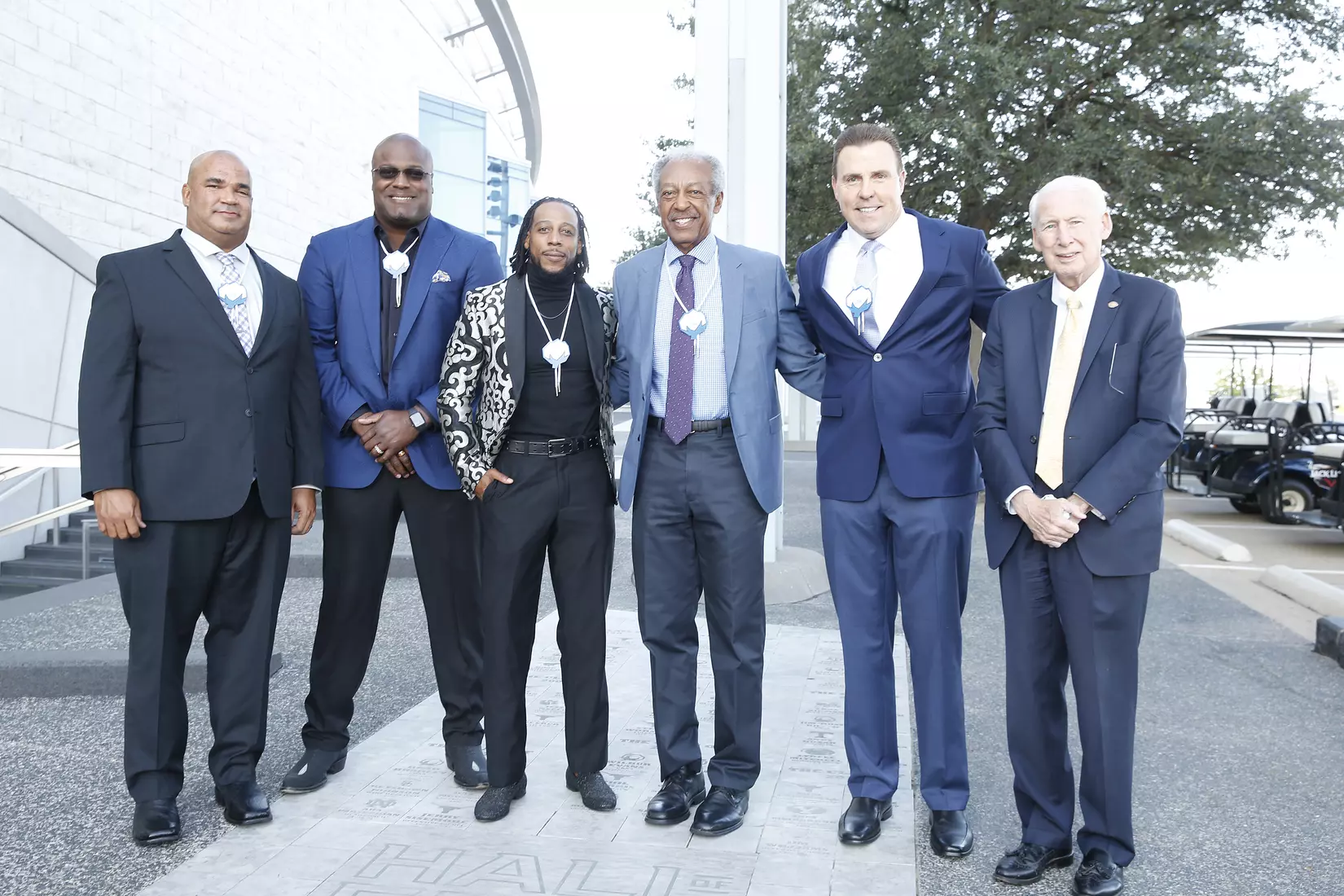 05 October 2021: Jonathan Beasley of Kansas State; Cory Redding of Notre Dame; Dexter McCluster of Mississippi; Tom Gatewood of Notre Dame; Bill Romanowski of Boston College; and Coach Bill Snyder of Kansas State pose with their bricks for the 2020 Cotton Bowl Hall of Fame class at the induction ceremony at AT&T Stadium in Arlington, Texas. Not pictured was Jerry Jones of Arkansas. Photo by James D. Smith/CBAA