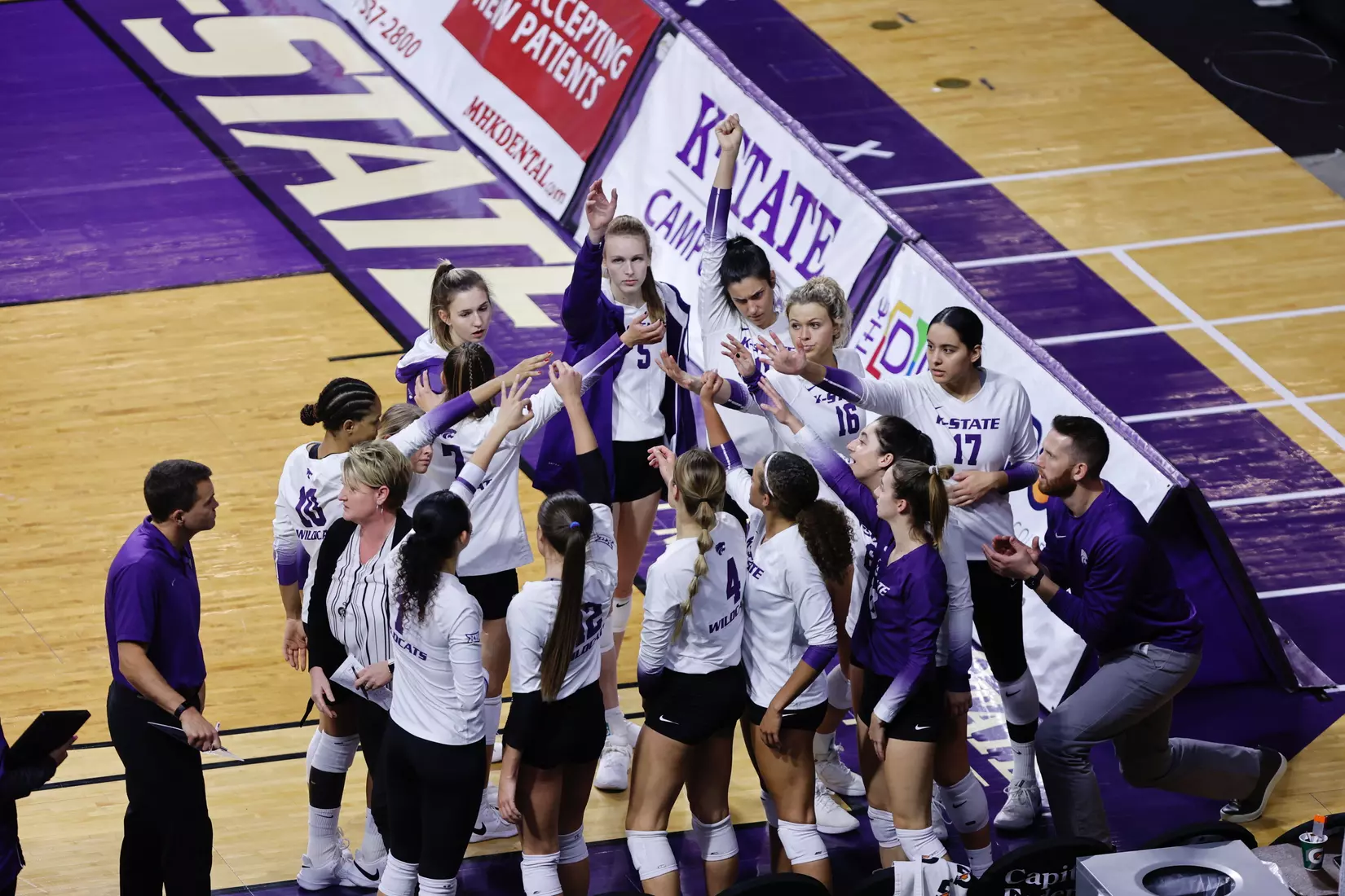 K-State huddles during their match against Kansas on Nov. 27th.