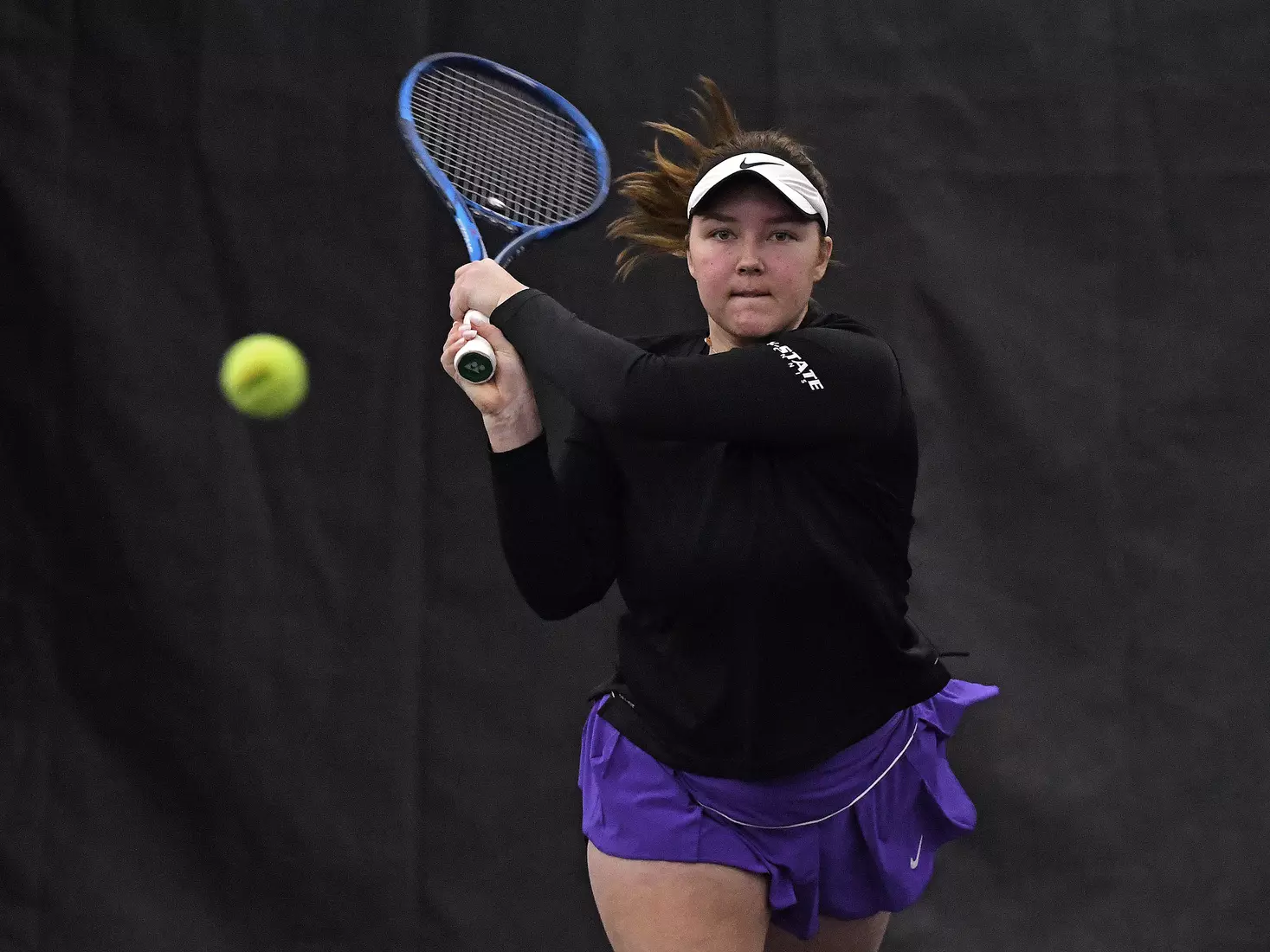 K-State’s Dinara Alloyarova competes against Memphis at the Body First Indoor Tennis Center in Manhattan, Kansas on February 11, 2022.