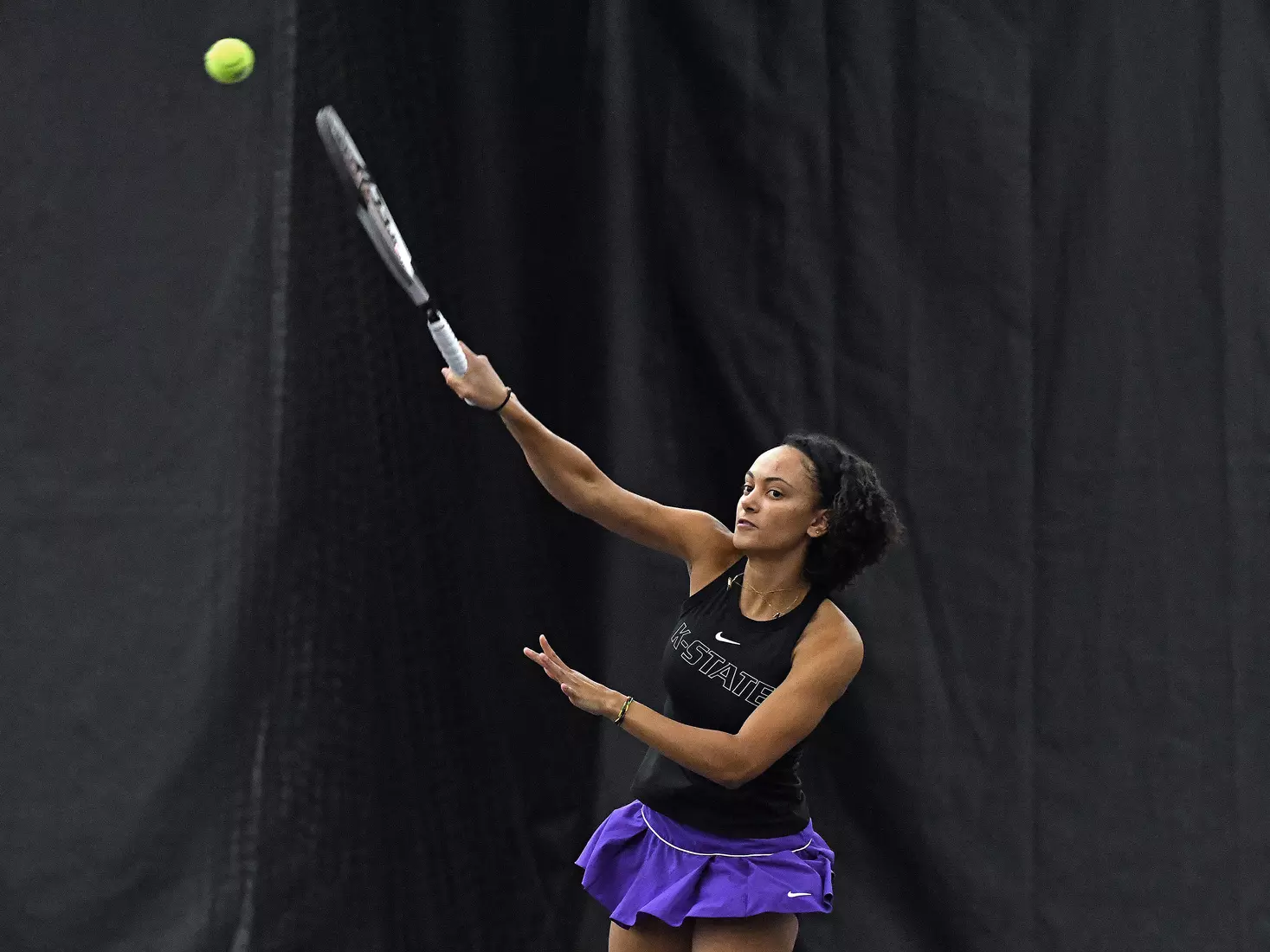 K-State’s Karine-Marion Job competes against Memphis at the Body First Indoor Tennis Center in Manhattan, Kansas on February 11, 2022.