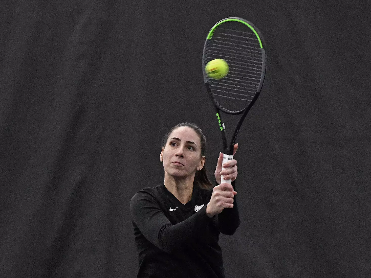K-State’s Ioana Gheorghita competes against Memphis at the Body First Indoor Tennis Center in Manhattan, Kansas on February 11, 2022.