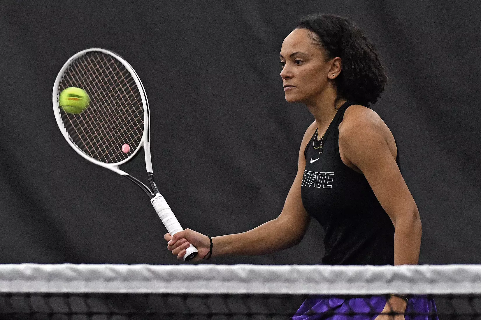 K-State’s Karine-Marion Job competes against Memphis at the Body First Indoor Tennis Center in Manhattan, Kansas on February 11, 2022.