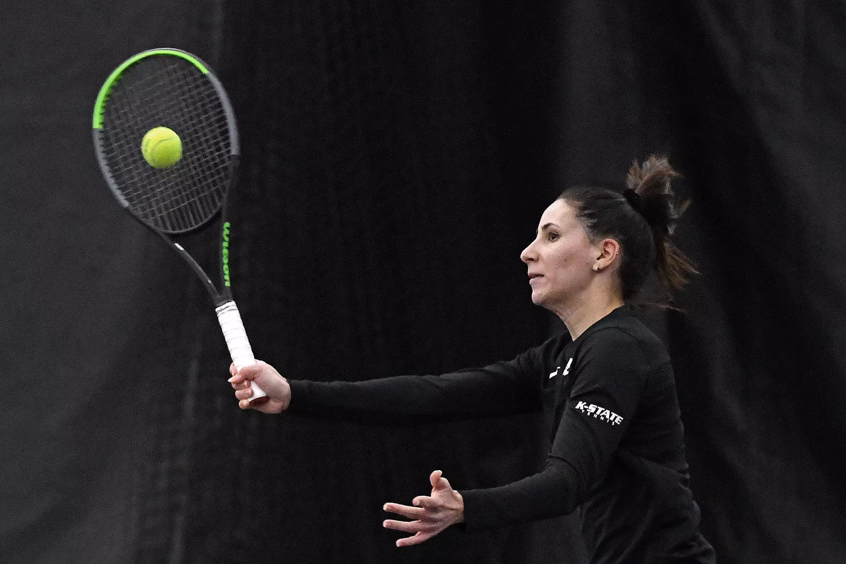 K-State’s Ioana Gheorghita competes against Memphis at the Body First Indoor Tennis Center in Manhattan, Kansas on February 11, 2022.
