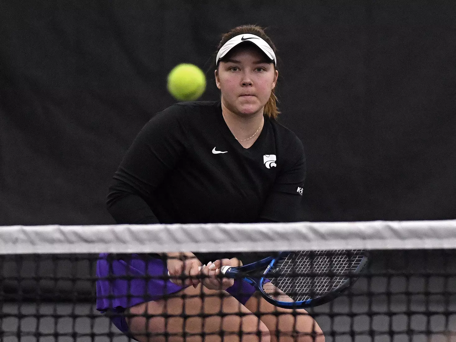 K-State’s Dinara Alloyarova competes against Memphis at the Body First Indoor Tennis Center in Manhattan, Kansas on February 11, 2022.