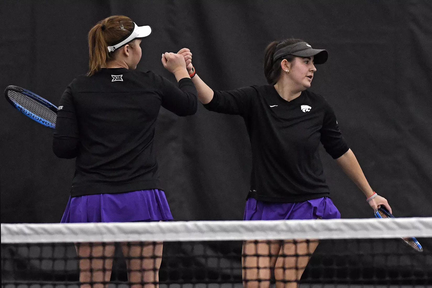 K-State’s Dinara Alloyarova and Anna Turco compete against Memphis at the Body First Indoor Tennis Center in Manhattan, Kansas on February 11, 2022.
