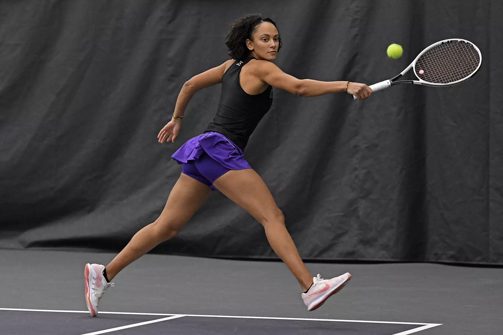 K-State’s Karine-Marion Job competes against Memphis at the Body First Indoor Tennis Center in Manhattan, Kansas on February 11, 2022.