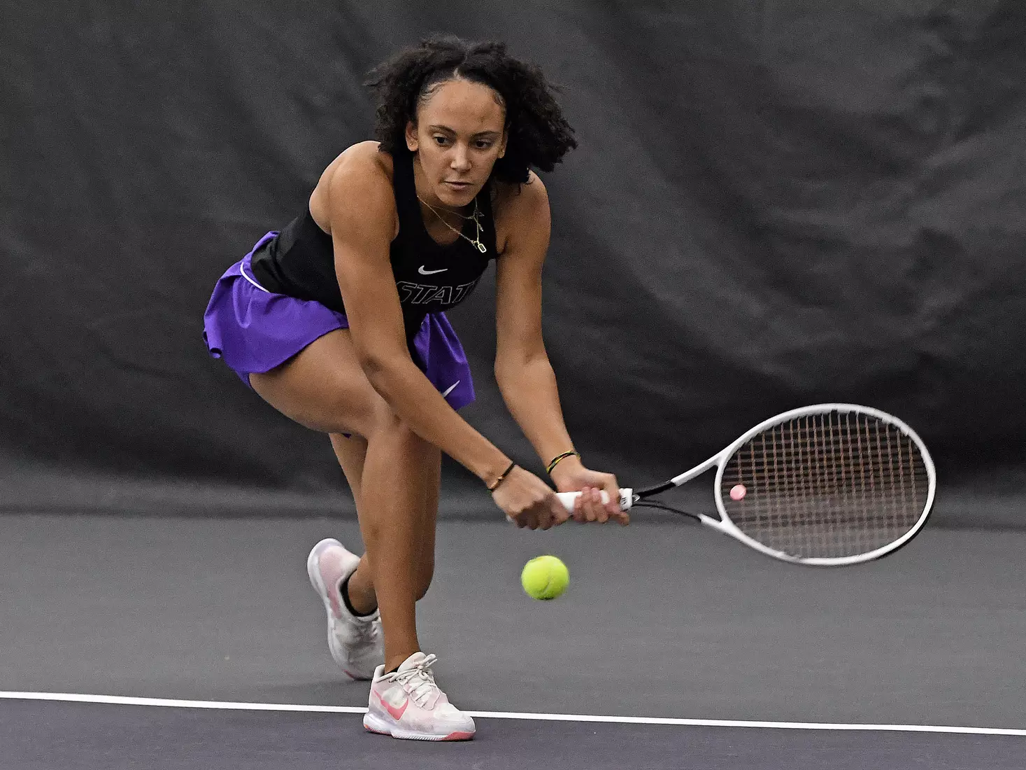 K-State’s Karine-Marion Job competes against Memphis at the Body First Indoor Tennis Center in Manhattan, Kansas on February 11, 2022.
