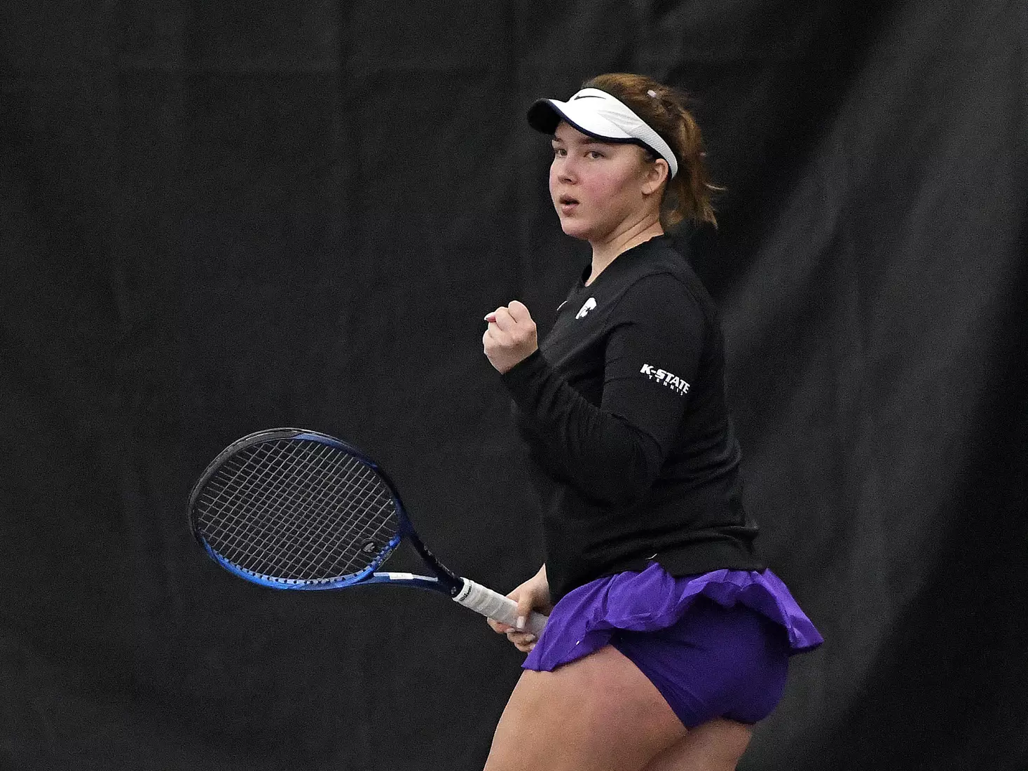 K-State’s Dinara Alloyarova competes against Memphis at the Body First Indoor Tennis Center in Manhattan, Kansas on February 11, 2022.