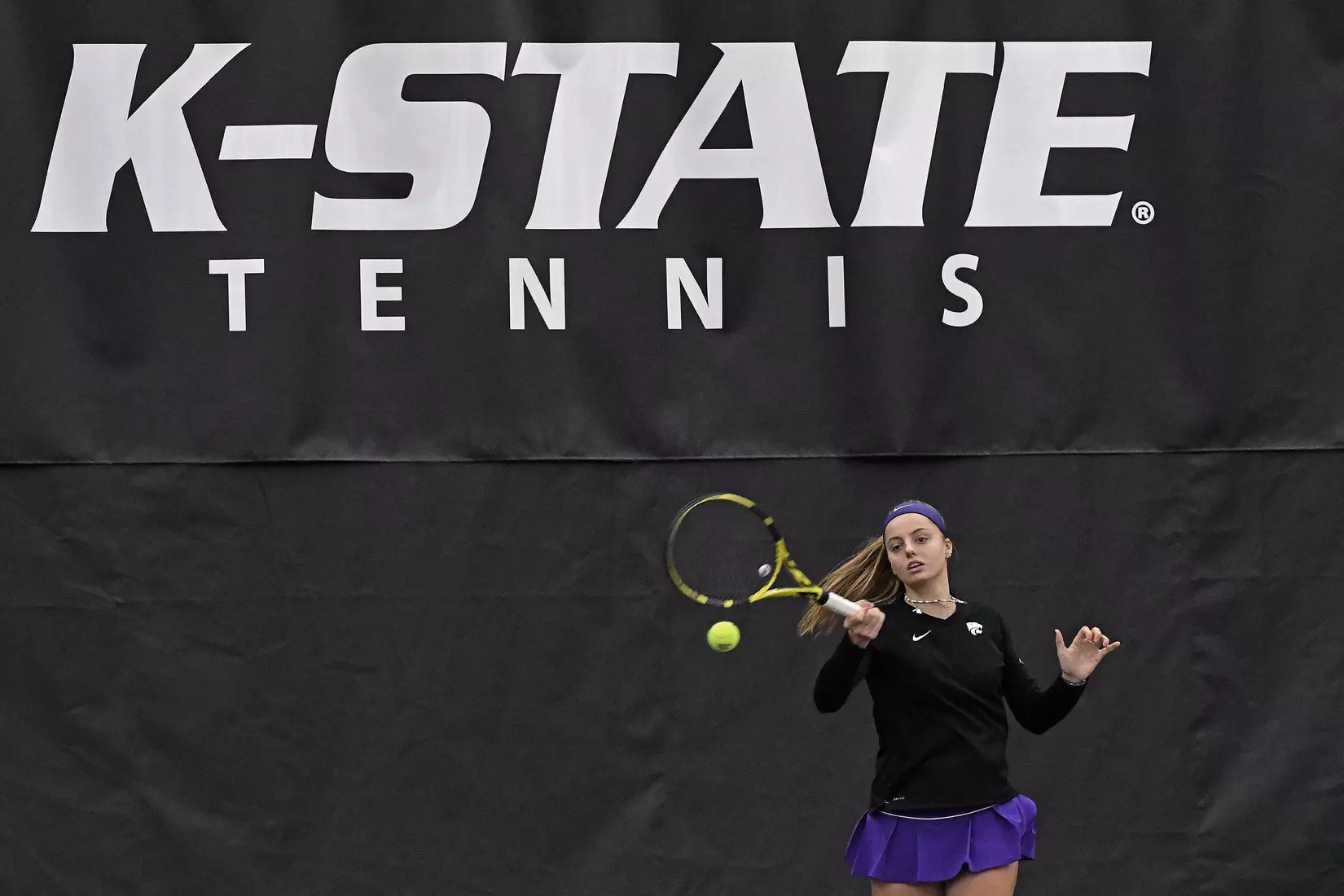 K-State’s Florentine Dekkers competes against Memphis at the Body First Indoor Tennis Center in Manhattan, Kansas on February 11, 2022.