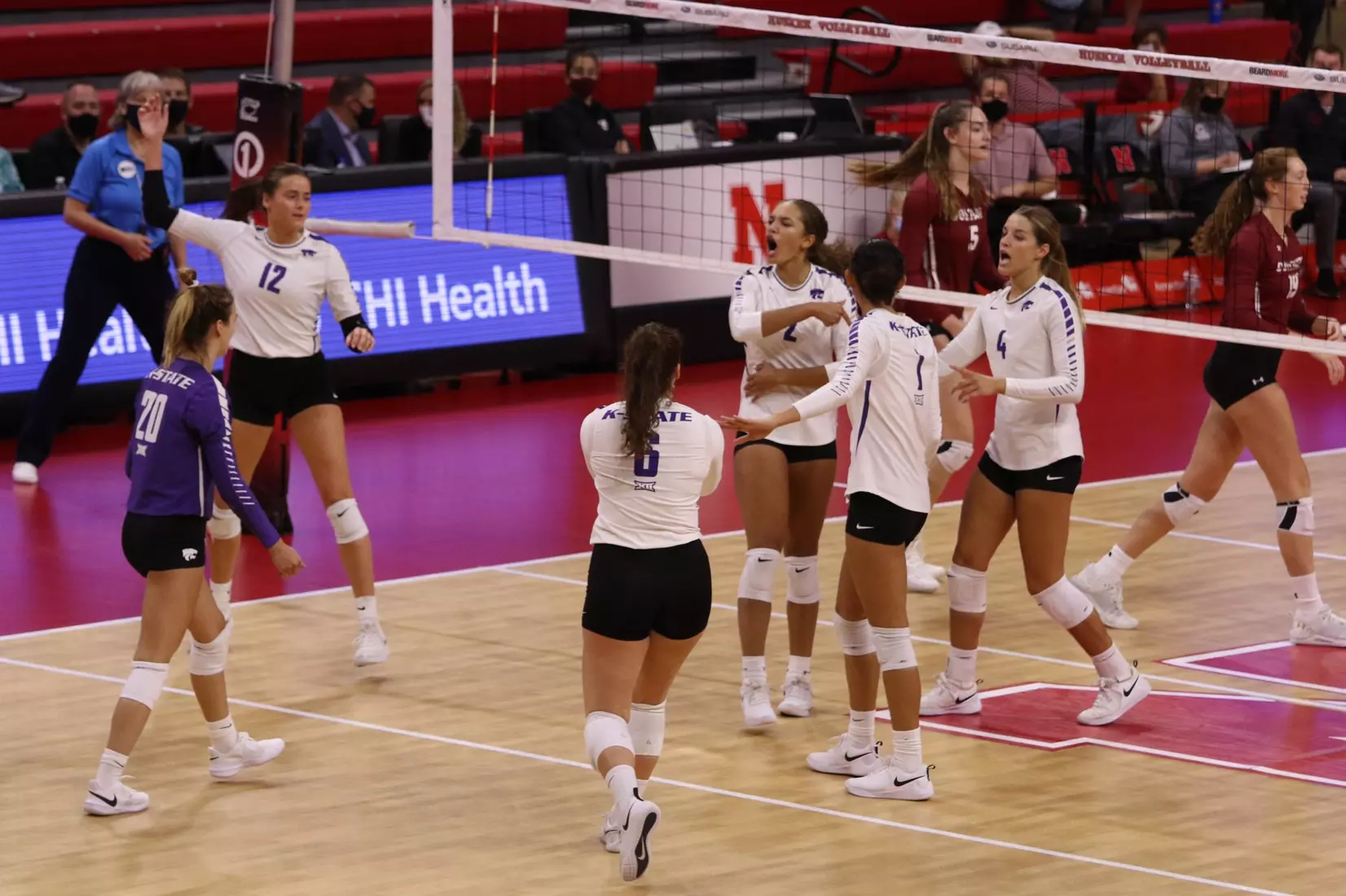 K-State celebrates against Colgate at the Husker Invitational on Friday.