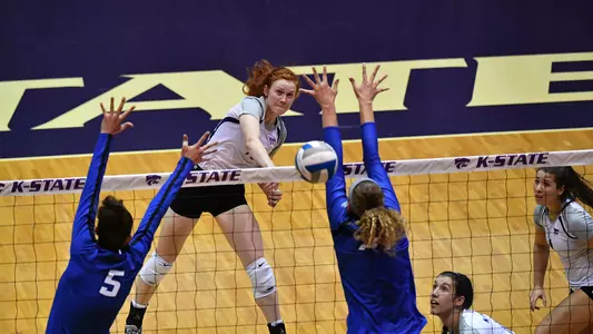 Bryna Vogel hits through the block.