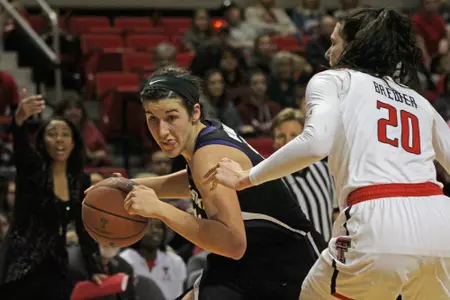 Peyton Williams Drives Past a Defender at Texas Tech