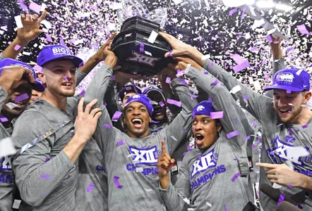 MANHATTAN, KS - MARCH 09: Players of the Kansas State Wildcats celebrate after wining the Big 12 Regular Season Championship on March 9, 2019 at Bramlage Coliseum in Manhattan, Kansas. (Photo by Peter G. Aiken/Getty Images) *** Local Caption ***