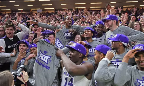 MANHATTAN, KS - MARCH 09: Players of the Kansas State Wildcats celebrate after wining the Big 12 Regular Season Championship on March 9, 2019 at Bramlage Coliseum in Manhattan, Kansas. (Photo by Peter G. Aiken/Getty Images) *** Local Caption ***