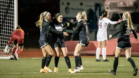 Brookelynn Entz (center) celebrates the first of two of her goals on Friday night at Iowa State.