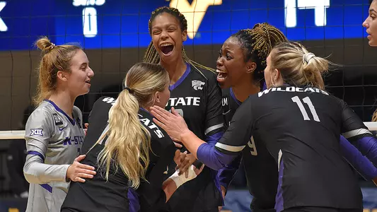 Jayden Nembhard celebrates with her teammates as K-State takes on West Virginia