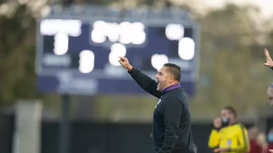 Mike Dibbini directs his team against Oklahoma