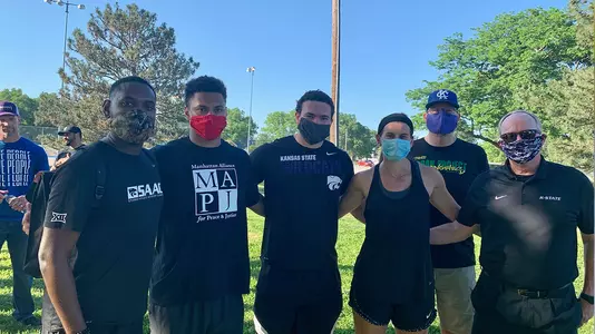 K-State student-athletes and staff members participate in protests in Manhattan