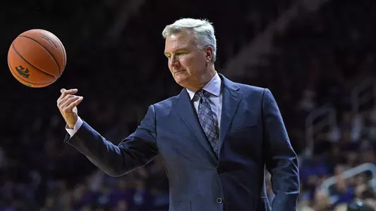 Bruce Weber tosses the game ball back against Emporia State at Bramlage Coliseum