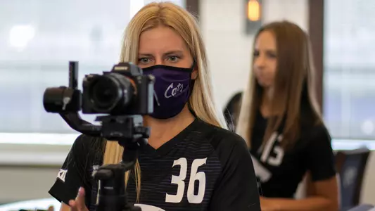 Maddie Souder steps behind the lense on photo day for K-State Soccer