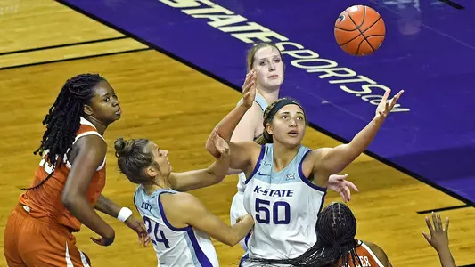 K-State's Emilee Ebert, Ayoka Lee, and Rachel Ranke compete against Texas at Bramlage Coliseum in Manhattan, Kansas on December 21, 2020.