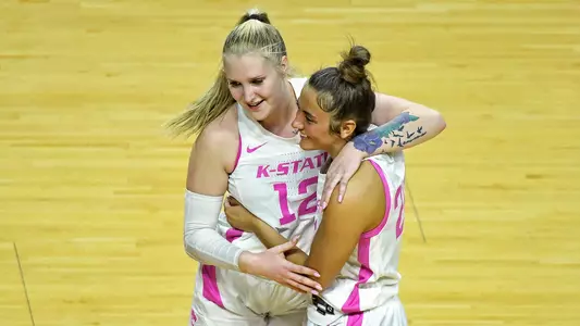 K-State's Rachel Ranke and Emilee Ebert celebrate after the game against Texas Tech at Bramlage Coliseum in Manhattan, Kansas on February 24, 2021.