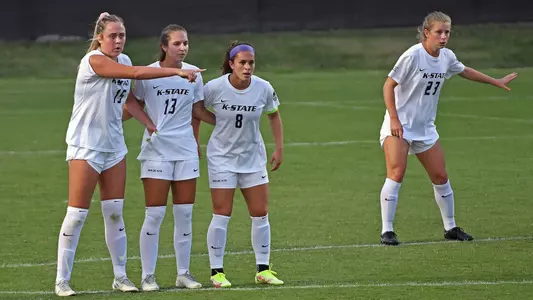 Jesse Loren, Bailey Nemechek, Brookelynn Entz defend a free kick.