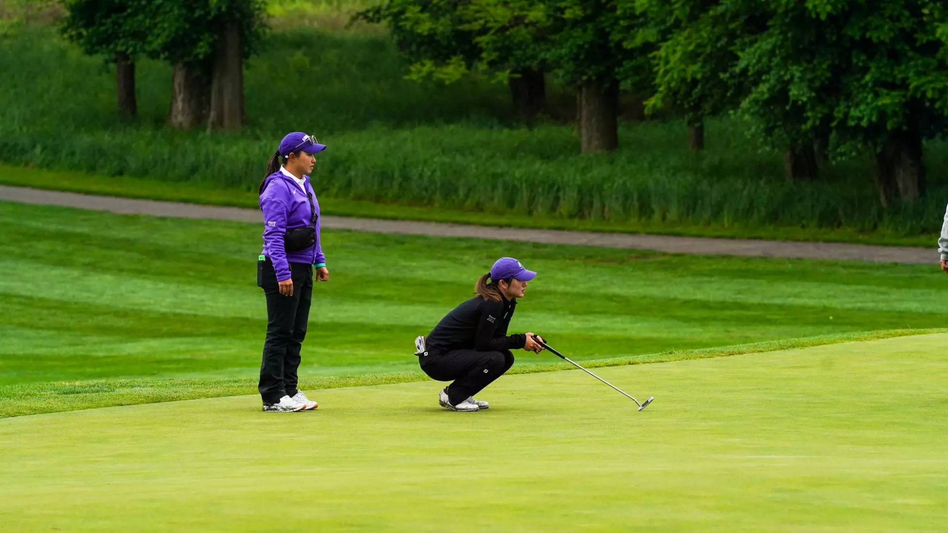 Assistant Coach Rinko Mitsunaga and Nanami Nakashima during the second round of the 2025 NCAA Lexington Regional on May 6, 2025. (Victoria Ahlbrecht)