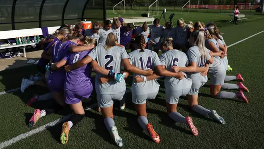 Team huddle at South Dakota