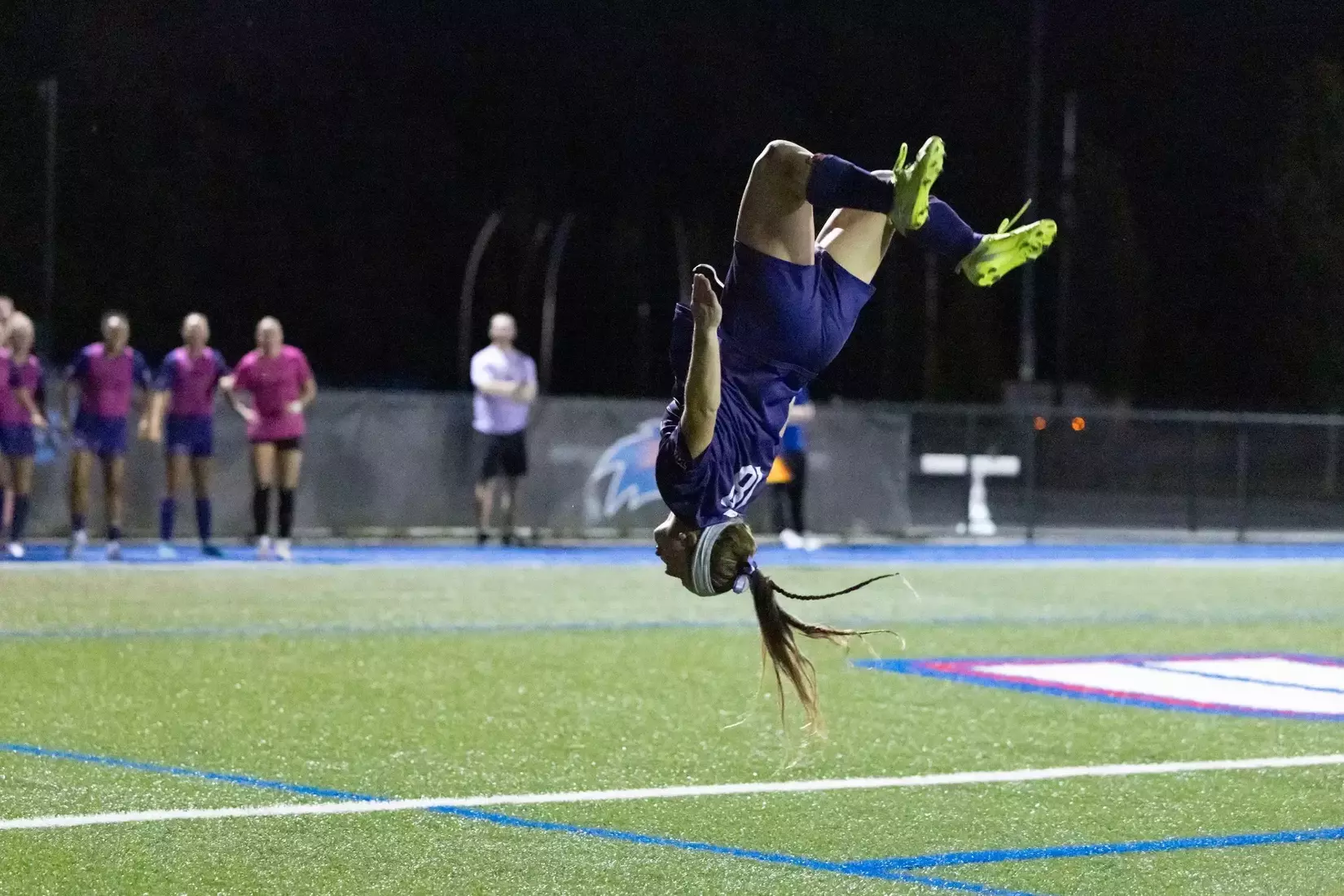 Hannah Palmer does a flip following her goal at UMass Lowell.