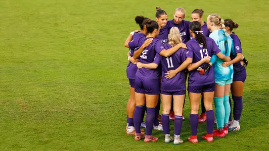 Team huddle vs. Arizona