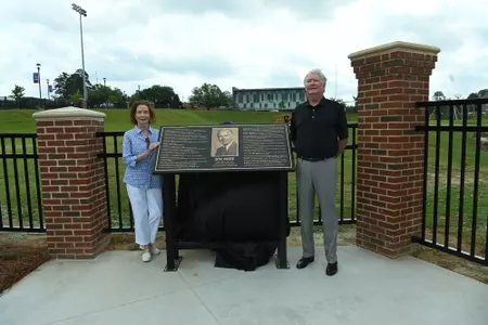 Ribbon cutting for the Jim Mize Track and Field Complex entrance and fence