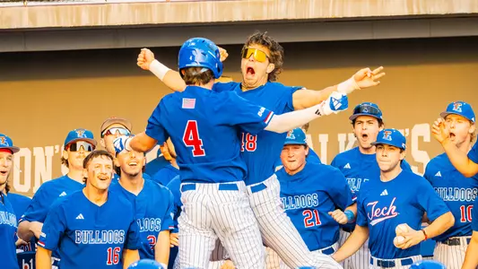 Cade Patterson celebrating after the first of his two grand slams in the season opener against Houston Christian.
