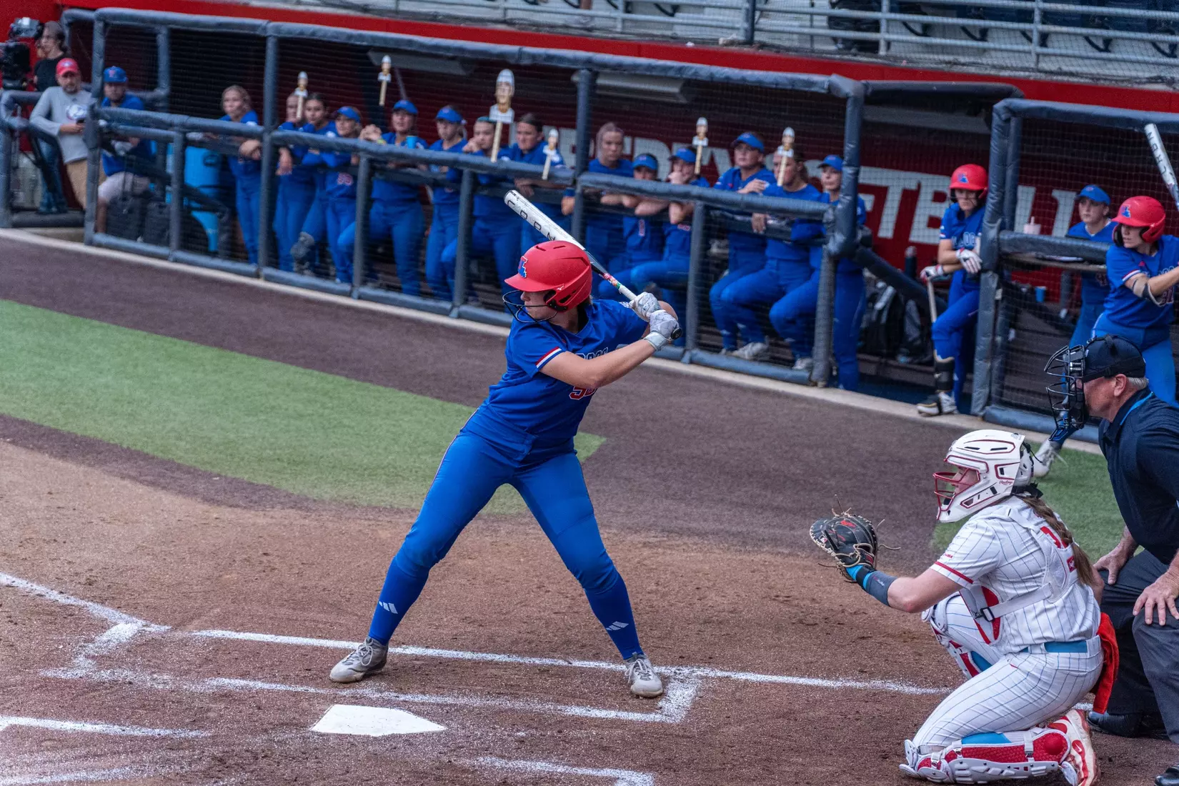 LA Tech defeats Liberty 7-2 in extra innings.