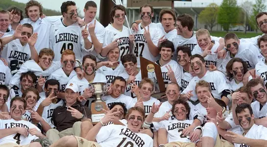 Mens Lacrosse Team with trophy