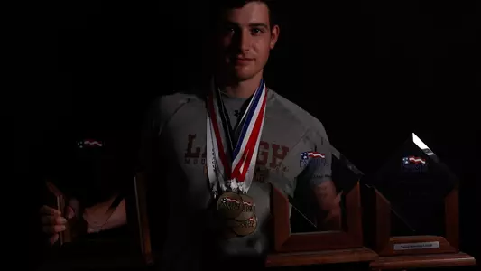Trevor Knowles with PLC Medals and Trophies