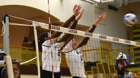 Luscomb and Stewart go up to make a block.
