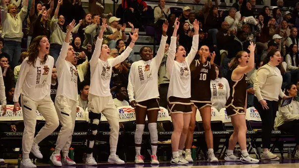 WBB team bench shot from PL Championship game at Holy Cross