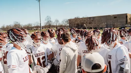 MLAX team huddle