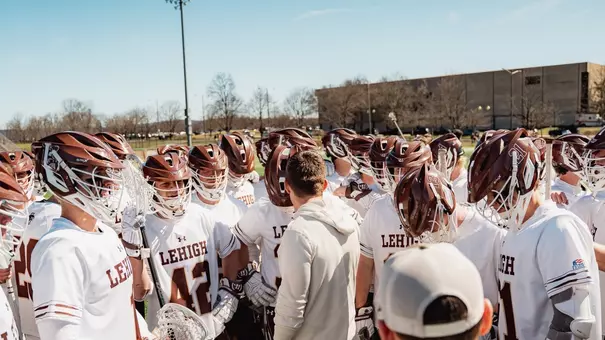 MLAX team huddle