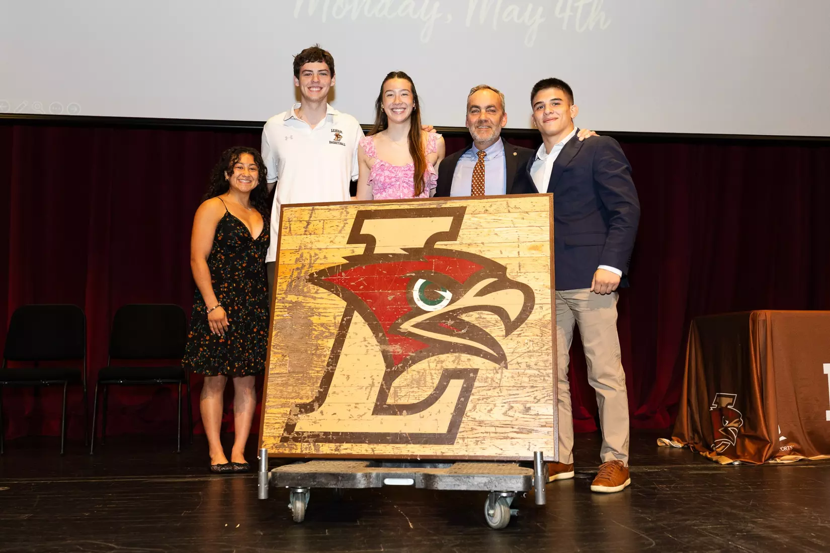 Our emcees present a special gift to Dean of Athletics Jeremy Gibson