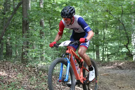 Beykirch climbs a hill after a switchback on a firetrail.