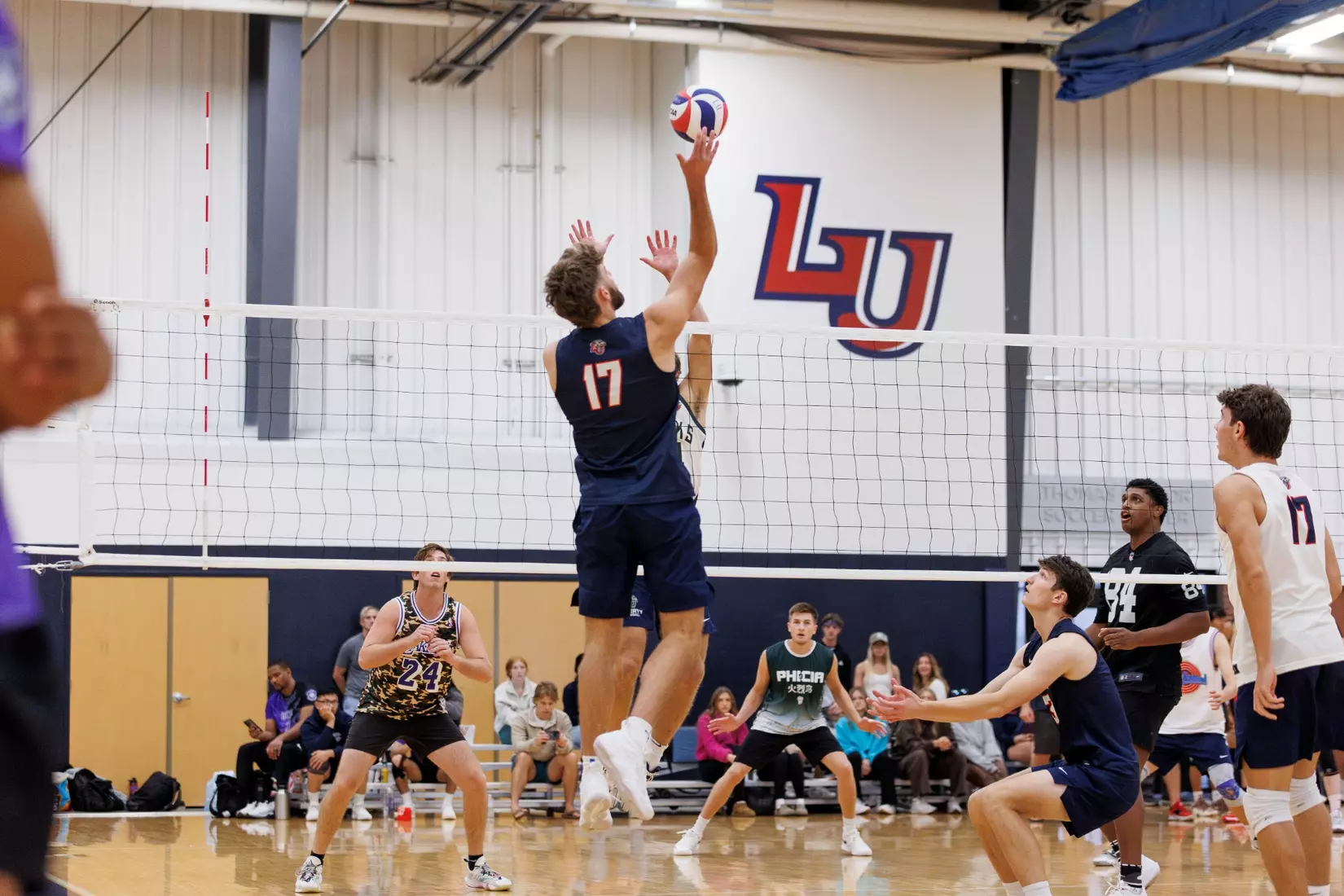 The Liberty Men’s Indoor Volleyball team faces an LU Alumni team at the Preseason ECVF Tournament in the Lahaye Multipurpose Center on October 18th, 2025. (Photo by Grace Greer)