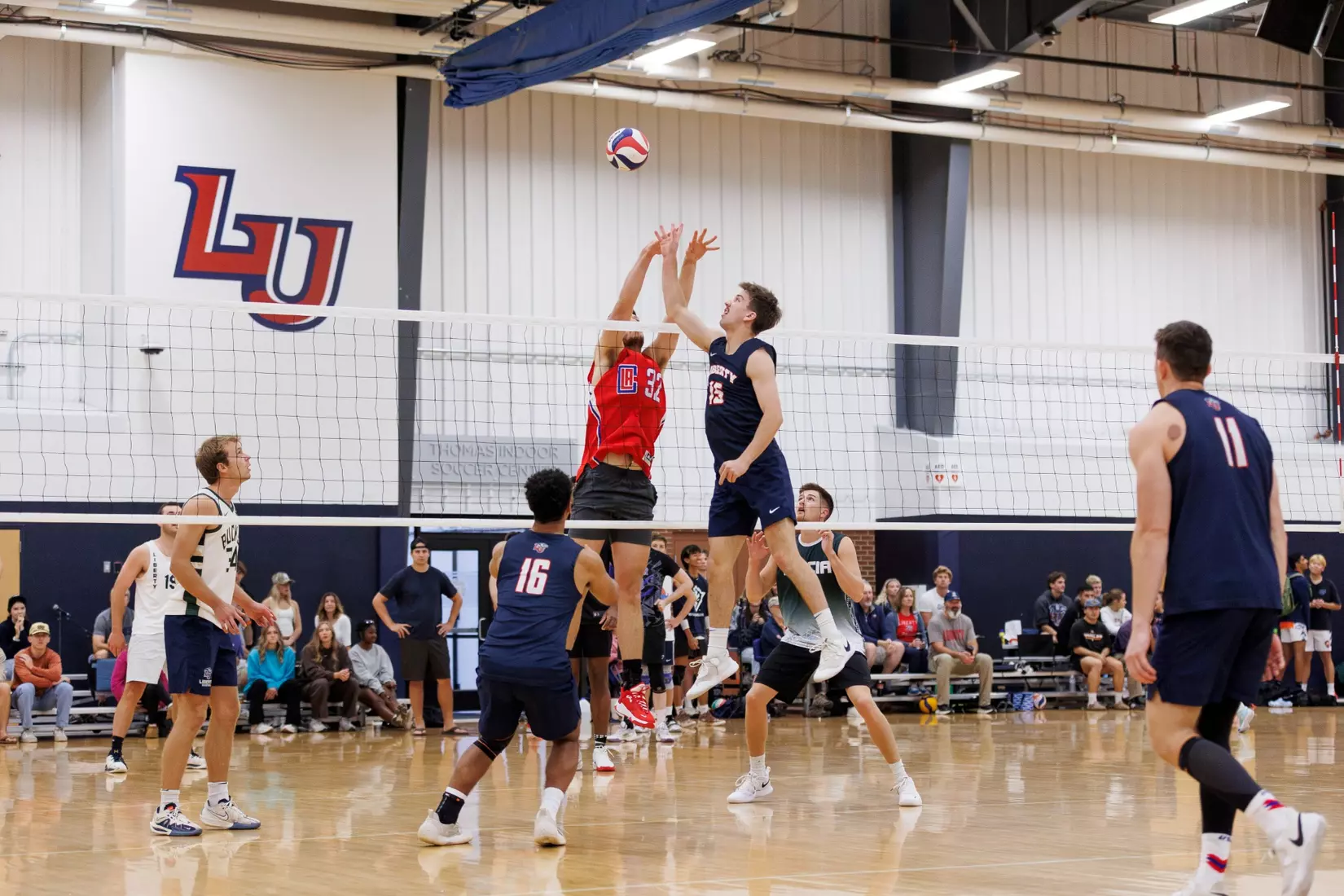 The Liberty Men’s Indoor Volleyball team faces an LU Alumni team at the Preseason ECVF Tournament in the Lahaye Multipurpose Center on October 18th, 2025. (Photo by Grace Greer)