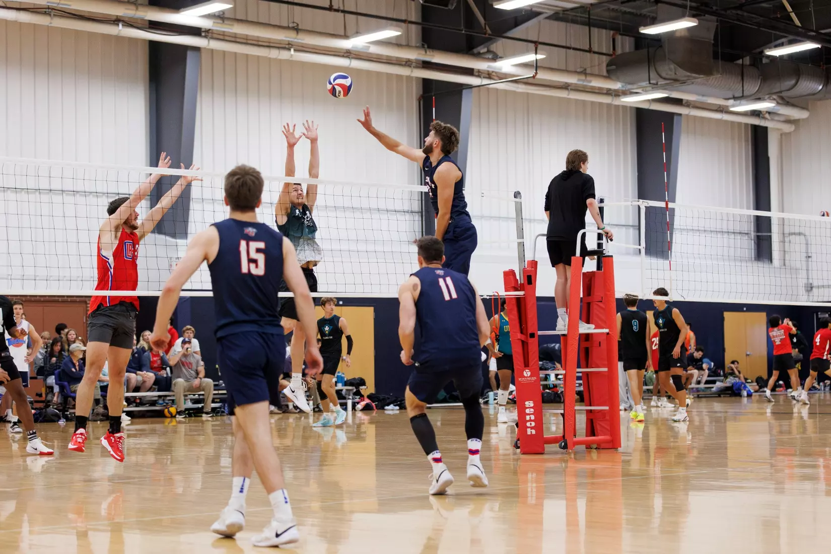 The Liberty Men’s Indoor Volleyball team faces an LU Alumni team at the Preseason ECVF Tournament in the Lahaye Multipurpose Center on October 18th, 2025. (Photo by Grace Greer)