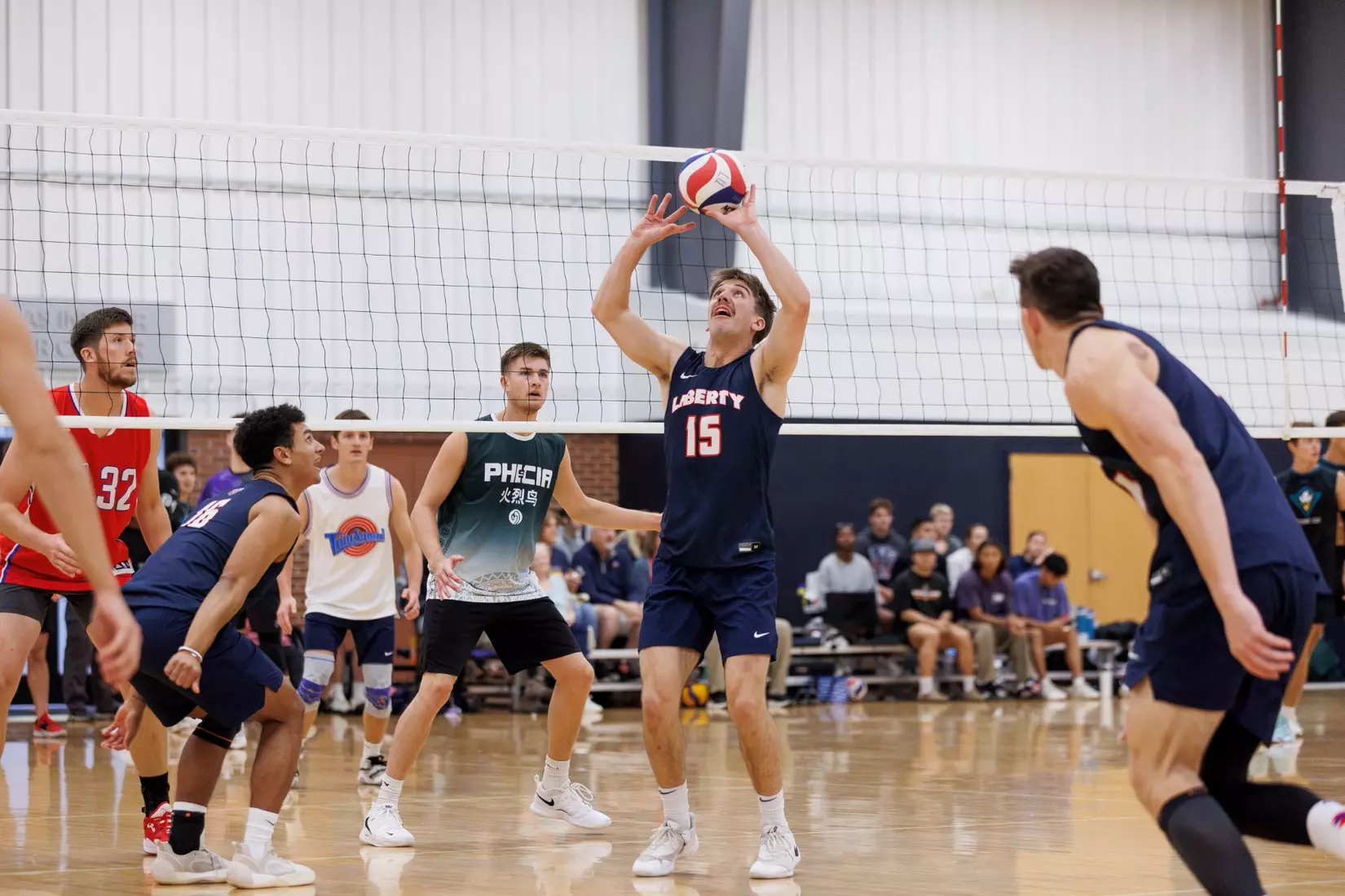 The Liberty Men’s Indoor Volleyball team faces an LU Alumni team at the Preseason ECVF Tournament in the Lahaye Multipurpose Center on October 18th, 2025. (Photo by Grace Greer)
