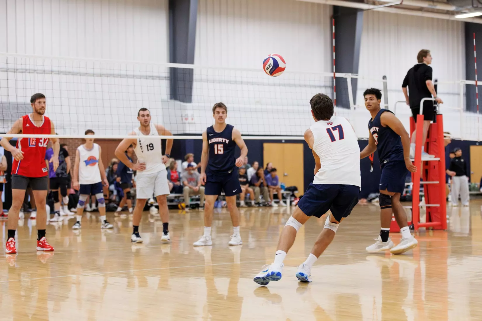 The Liberty Men’s Indoor Volleyball team faces an LU Alumni team at the Preseason ECVF Tournament in the Lahaye Multipurpose Center on October 18th, 2025. (Photo by Grace Greer)