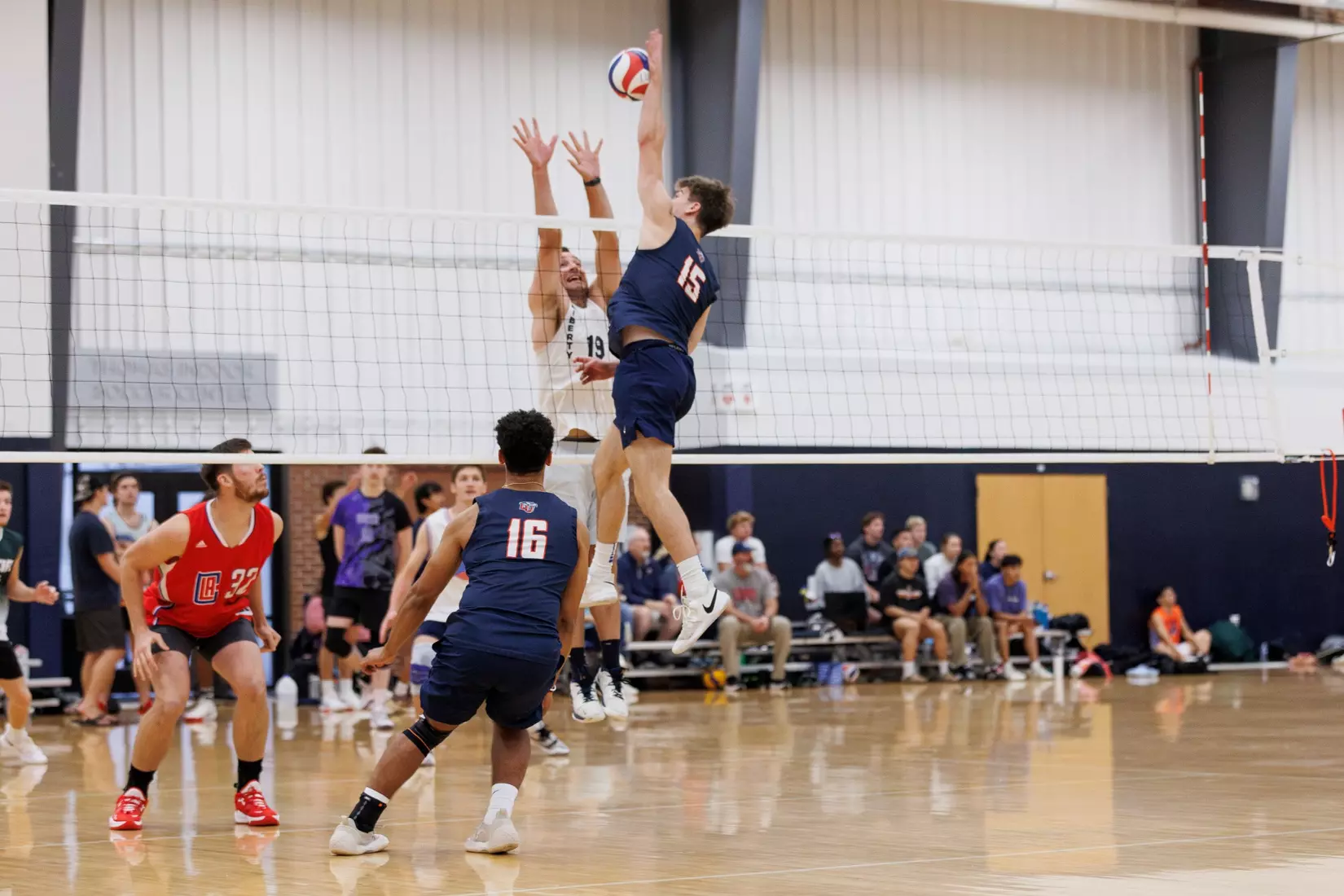 The Liberty Men’s Indoor Volleyball team faces an LU Alumni team at the Preseason ECVF Tournament in the Lahaye Multipurpose Center on October 18th, 2025. (Photo by Grace Greer)