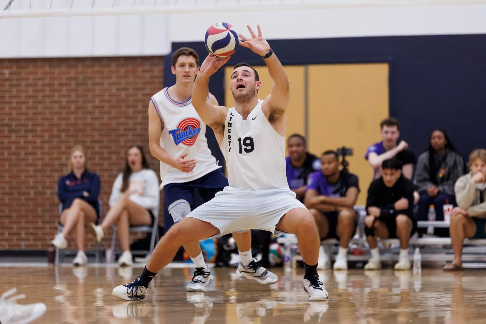 The Liberty Men’s Indoor Volleyball team faces an LU Alumni team at the Preseason ECVF Tournament in the Lahaye Multipurpose Center on October 18th, 2025. (Photo by Grace Greer)